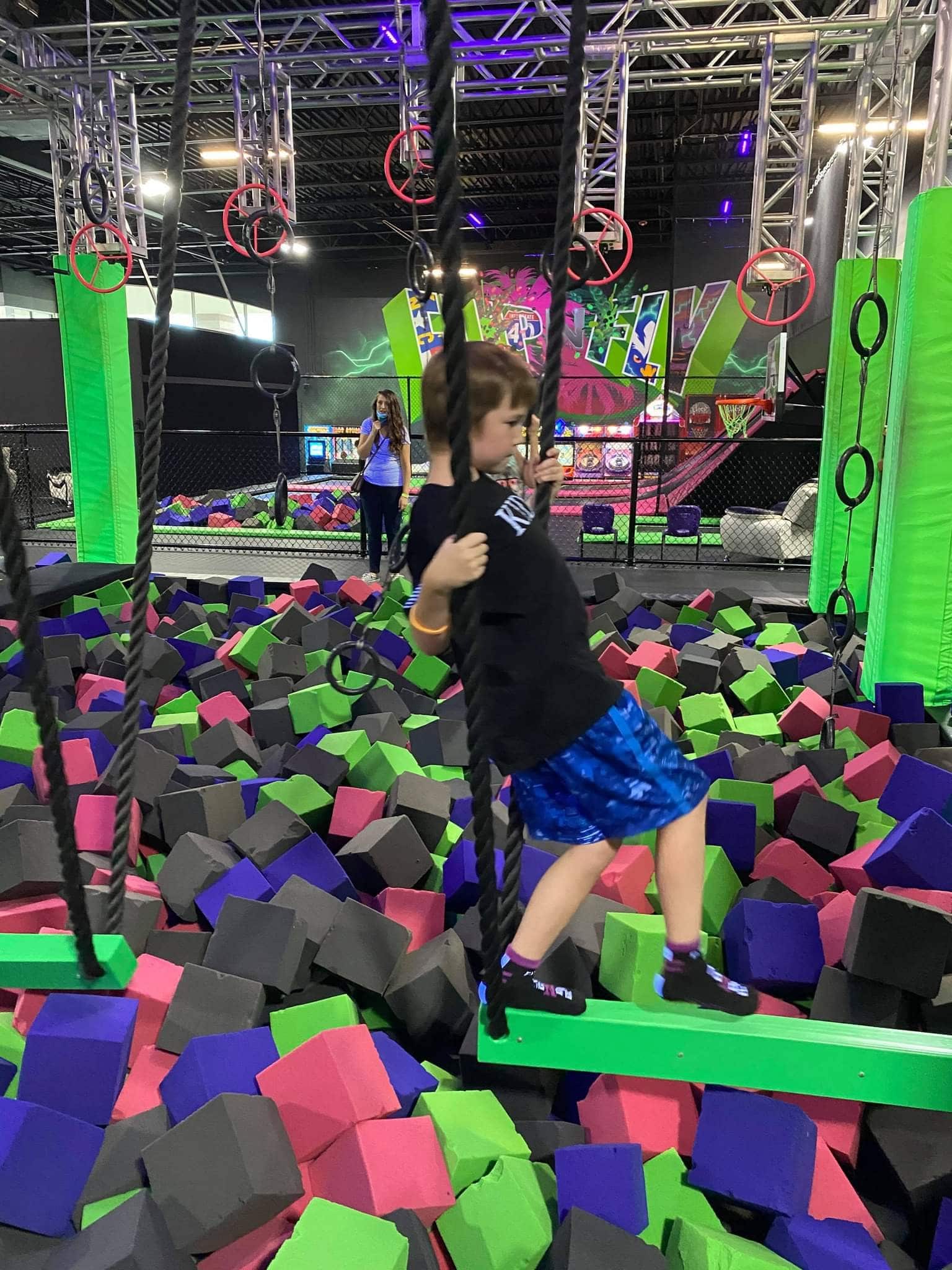 Young Boy Playing in Foam Pit