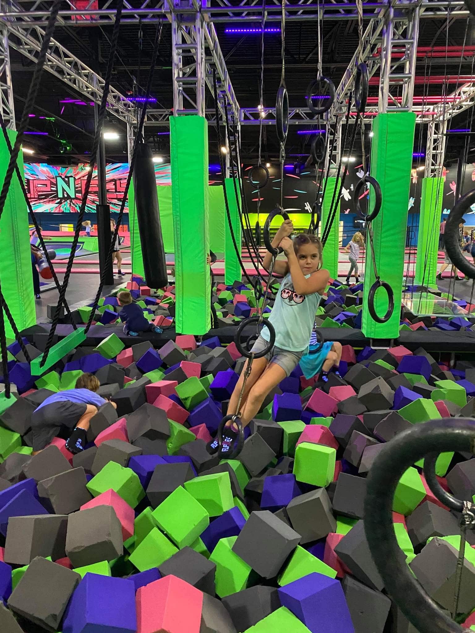 Young Girl Playing in Foam Pit